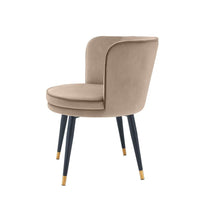 Additional view of Dining Chair Grenada, featuring matte black legs, velvet, metal, and fixed continuous curved arms.