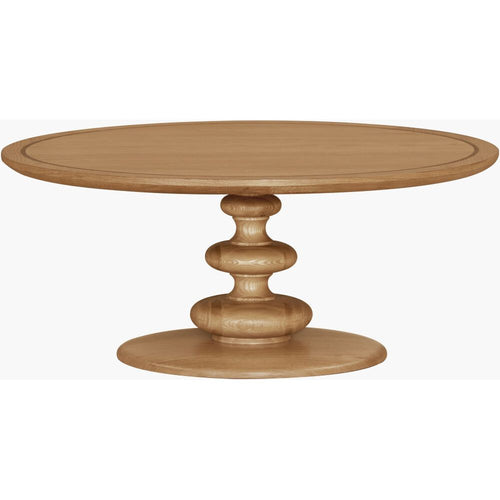 Adour Coffee Table, shown in light natural oak / honey wood with wood and a round pedestal base.
