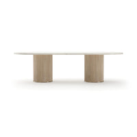 Rhythm Oval Stone Top Dining Table 112, shown in ivory and beige with stone, wood, and dual pedestal base.