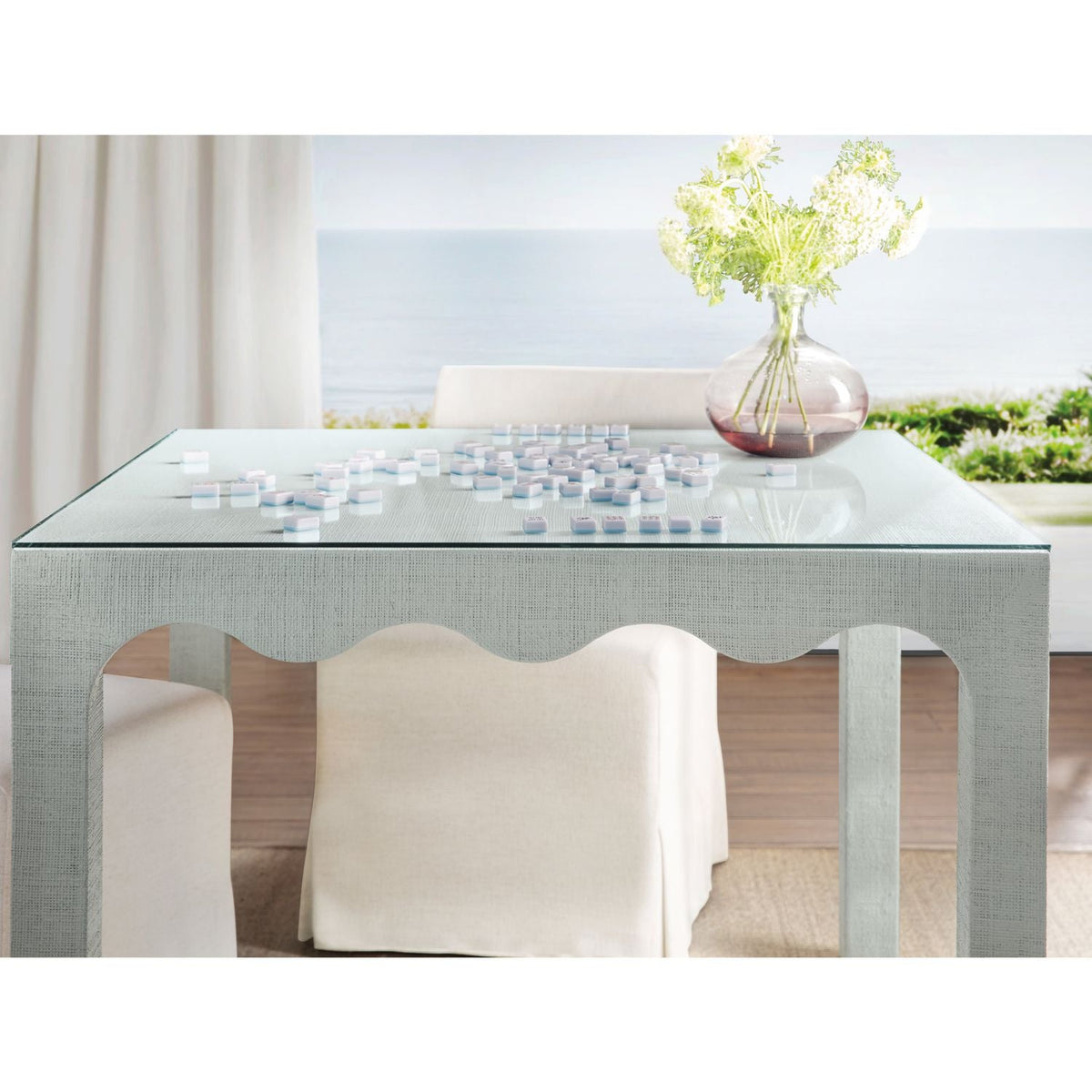 Additional view of Commerce and Market Naomi Raffia Game Table in soft mint green and pale seafoam.