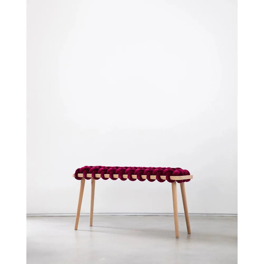 Burgundy Velvet Woven Bench, shown in burgundy and magenta with velvet, wood, and four fixed tapered legs.