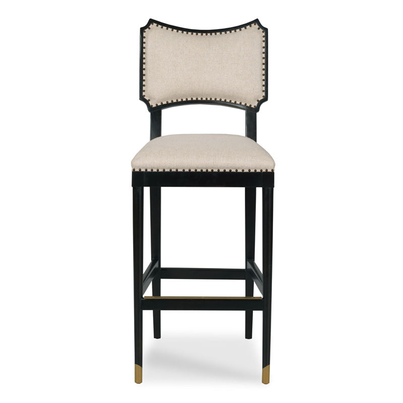 Powers Stool, shown in black and cream with wood, fabric, and integrated footrest with brass accent bar.