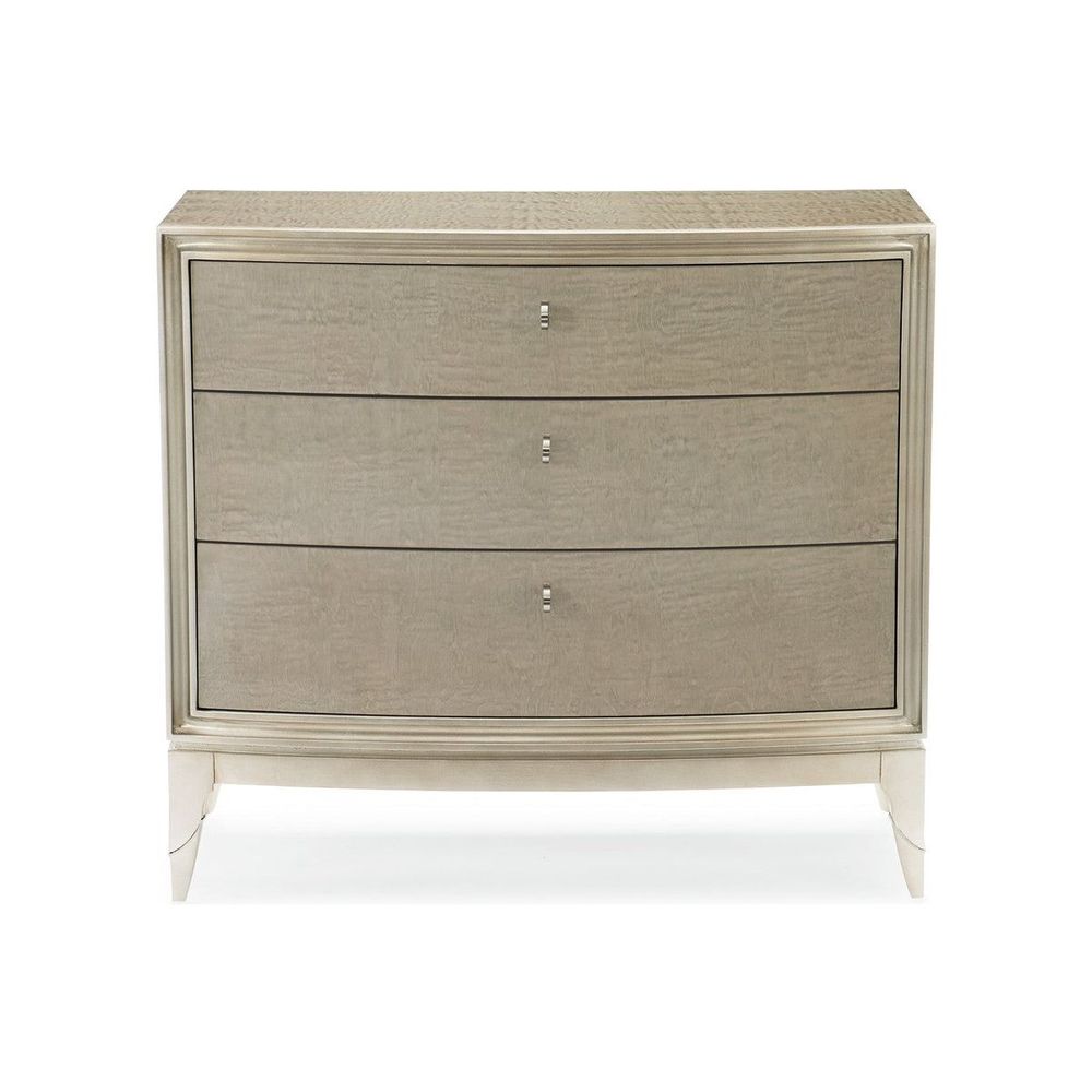Awaken, shown in warm gray and champagne silver with wood, metal, and three drawers.