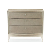 Awaken, shown in warm gray and champagne silver with wood, metal, and three drawers.