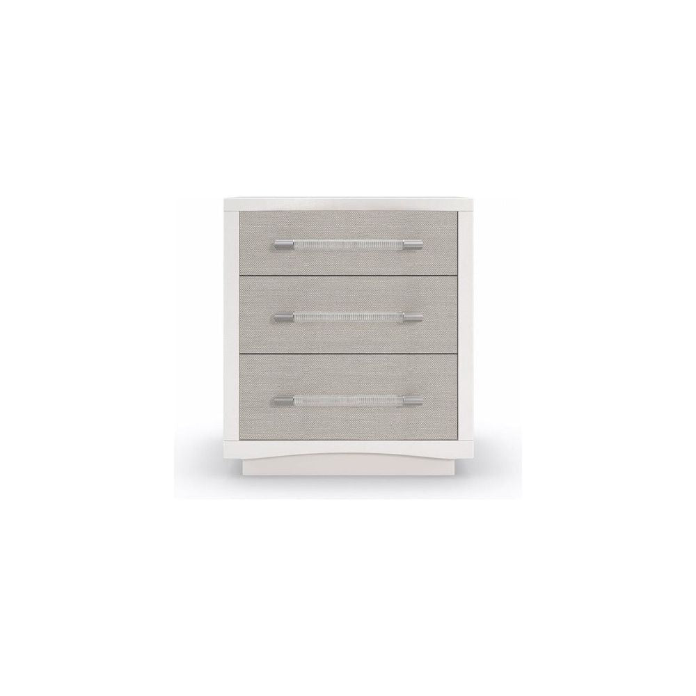 Lucidity, shown in white and light gray with wood, fabric, and three stacked drawers.