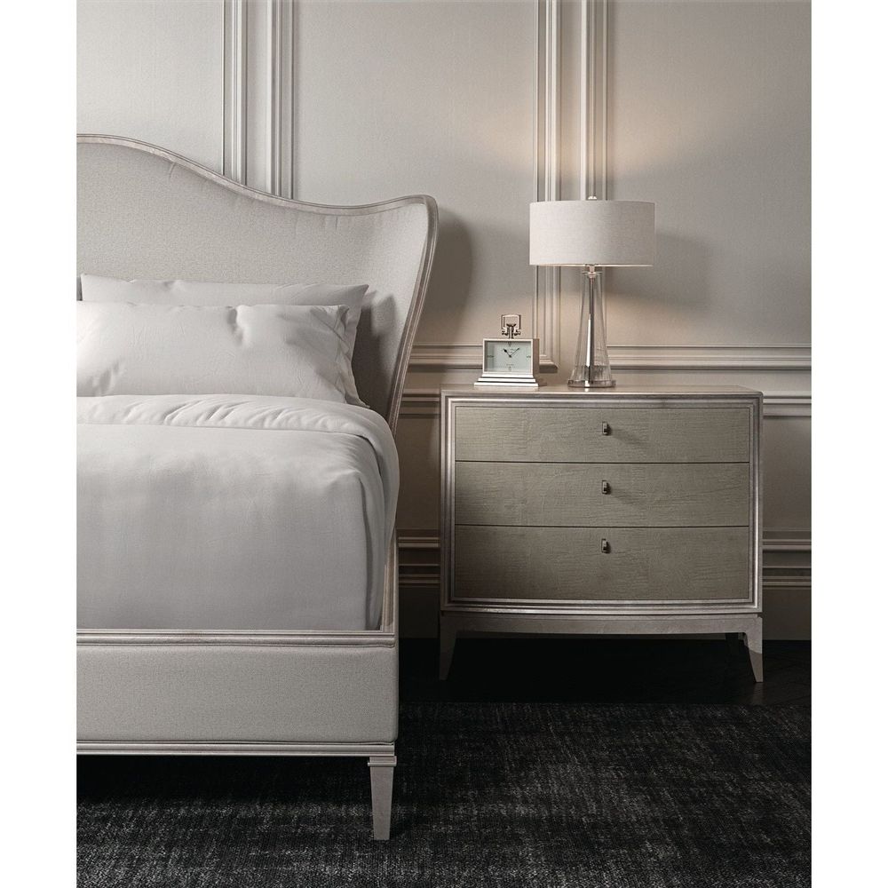 Additional view of Awaken in warm gray and champagne silver, featuring brushed metallic trim and three drawers.