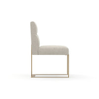 Additional view of Counter Balance Dining Chair in ivory and warm brass, featuring upholstered and armless.