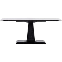 Amboss Dining Table, shown in black with iron, metal, and a central pedestal base.