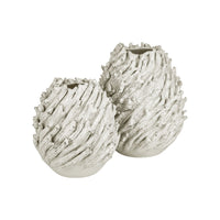Seadrift White Vase, shown in white with ceramic and open circular mouth for floral or stem arrangements.