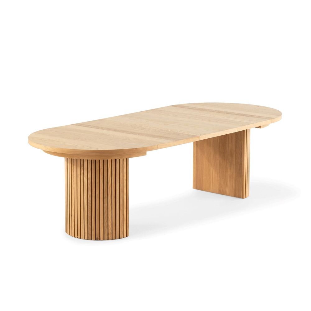 The Transformer Round Table, shown in light oak and natural blonde wood with solid wood and oak veneer or solid oak.