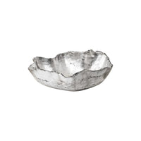 Orion Bowl, shown in silver and off-white with metal, cast resin, and open shallow basin.