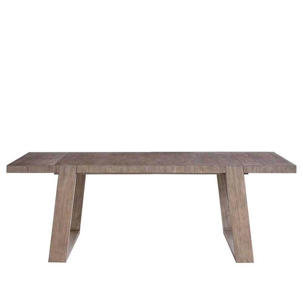 Boulder Dining Table, shown in light taupe gray-brown with wood and extendable top with visible leaf seams.