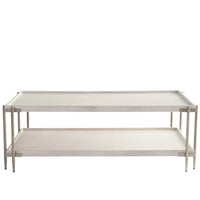 Selkie Cocktail Table, shown in light beige and warm white with wood, metal, and two-tier open shelf storage.