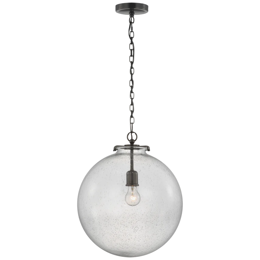 Ava Large Globe Pendant, shown in clear and bronze with seeded glass, metal, and chain suspension.